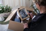 Woman is packing things of her dead husband